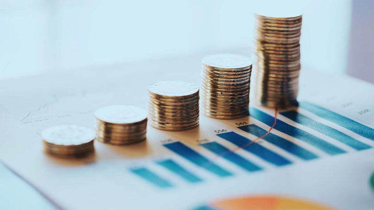 Coins stacked like a rising graph.